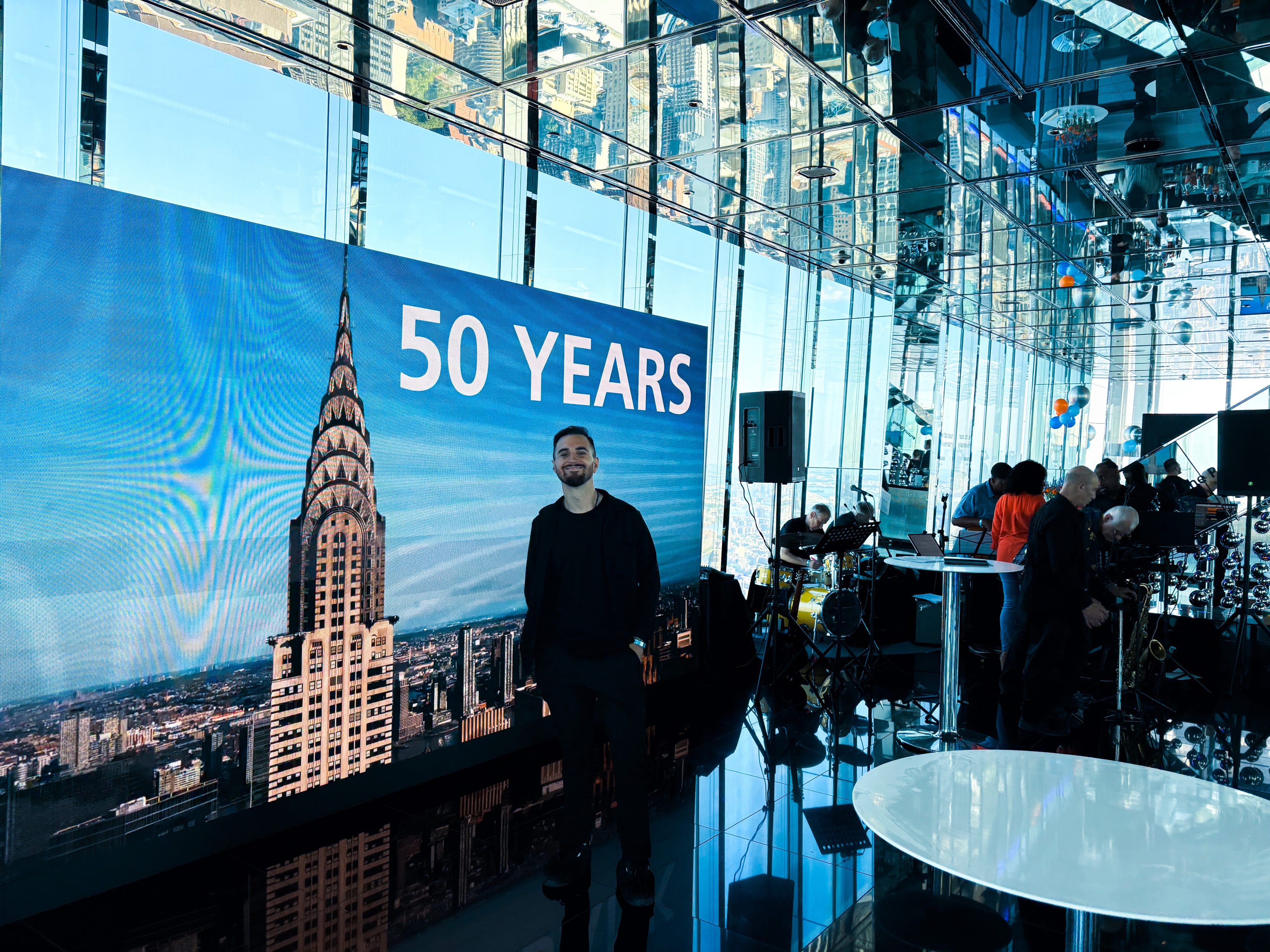 Event space with the “50 Years” screen at the DZ Bank summit