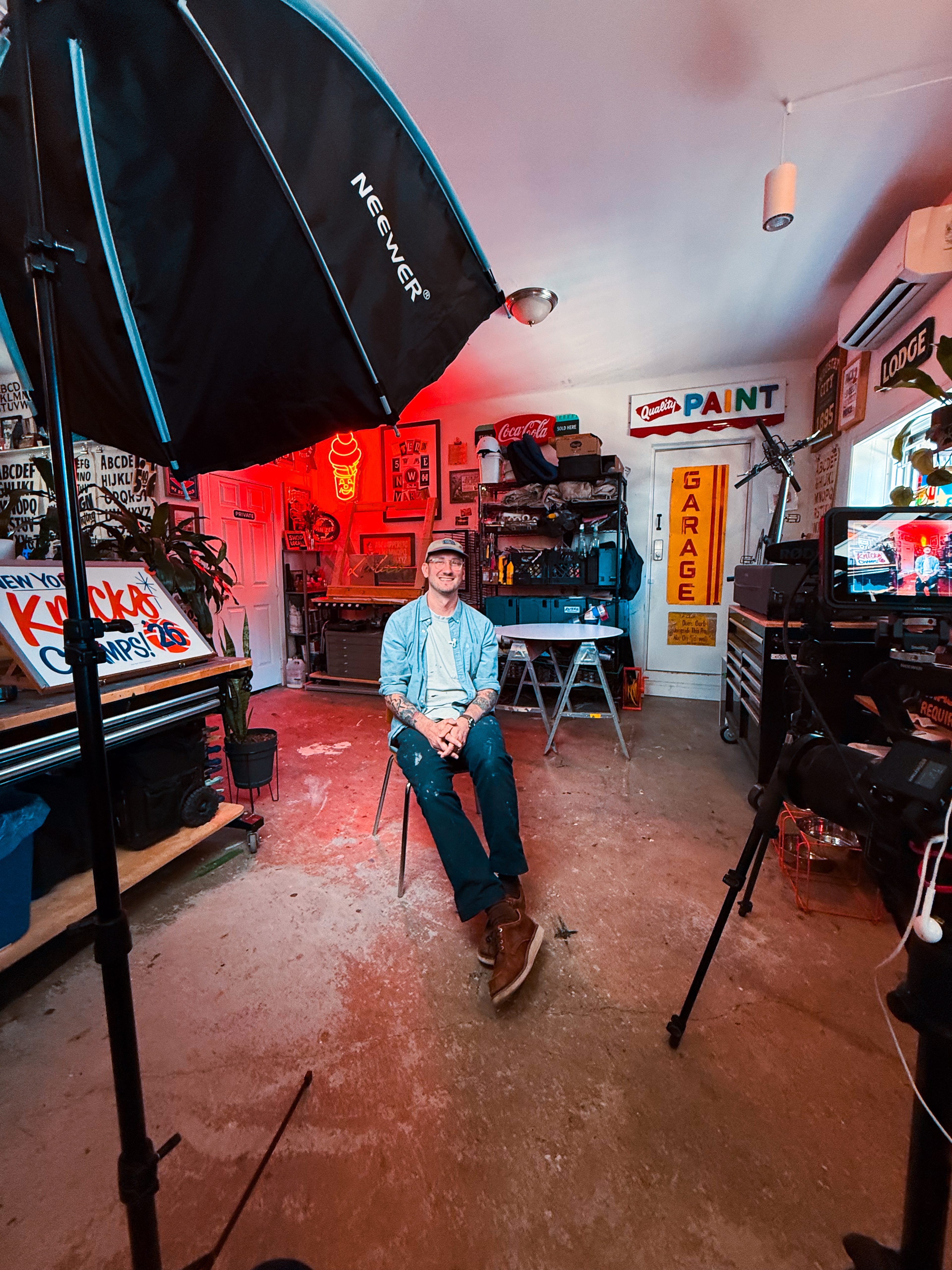 Interview setup in the red-lit sign studio