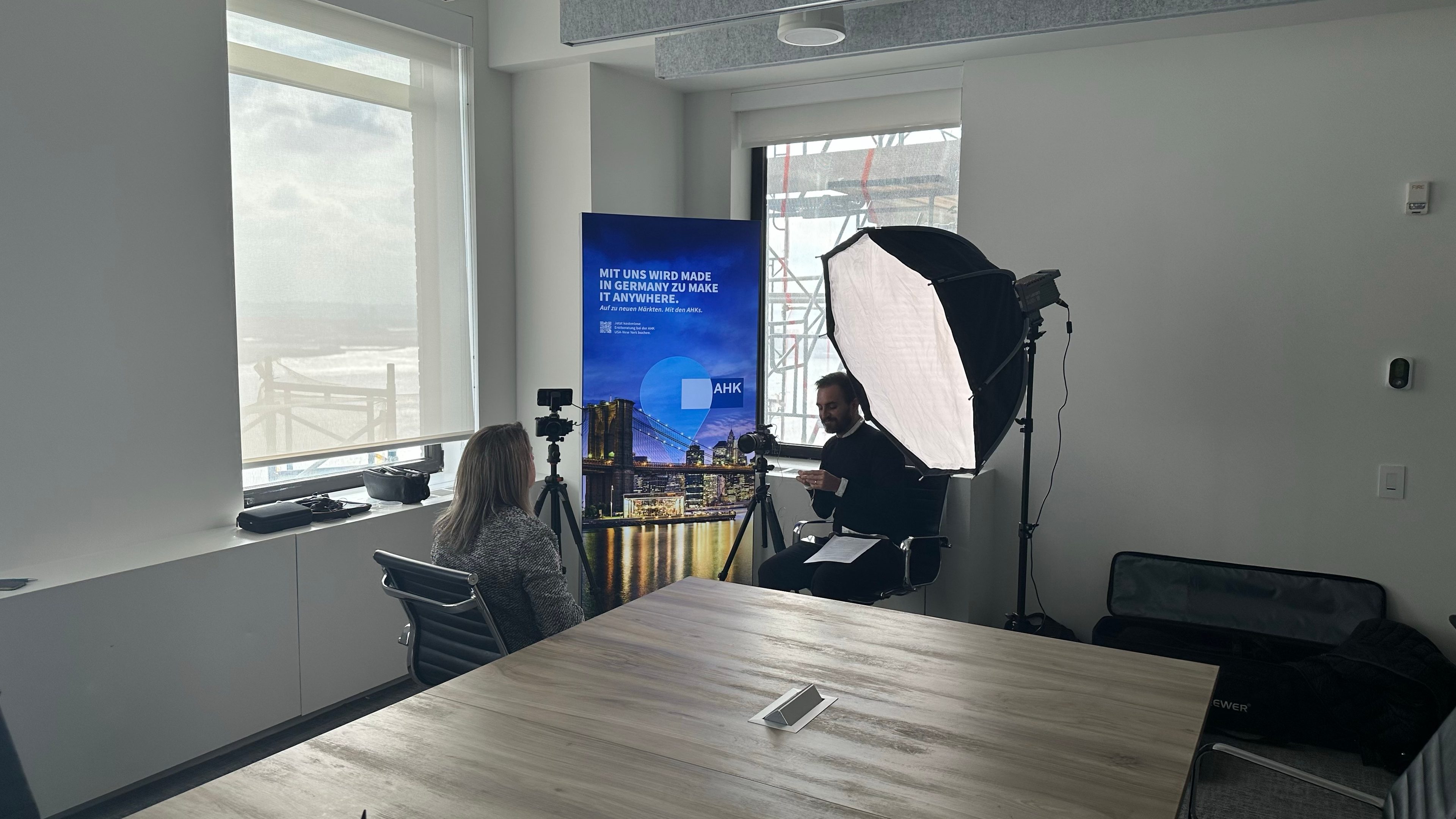 Interview setup with a softbox beside a GACC banner