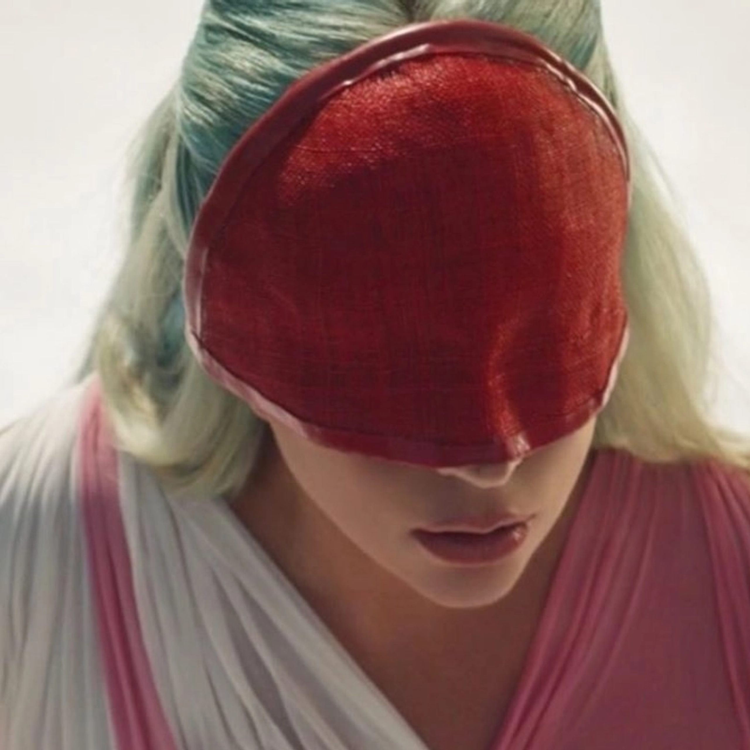 Close up of Lady Gaga with red face covering