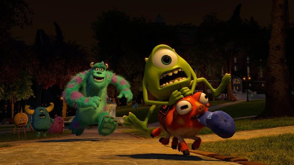 Mike rides Archie the pig as Sulley gives chase in Monsters University