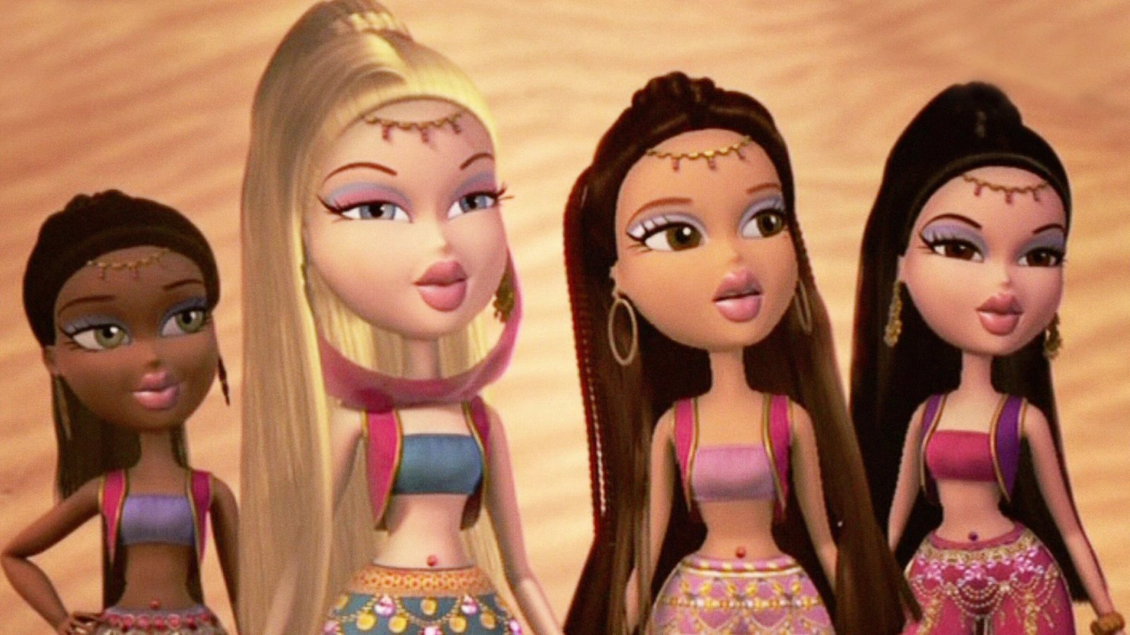 The Bratz together in pink and jewel-toned outfits