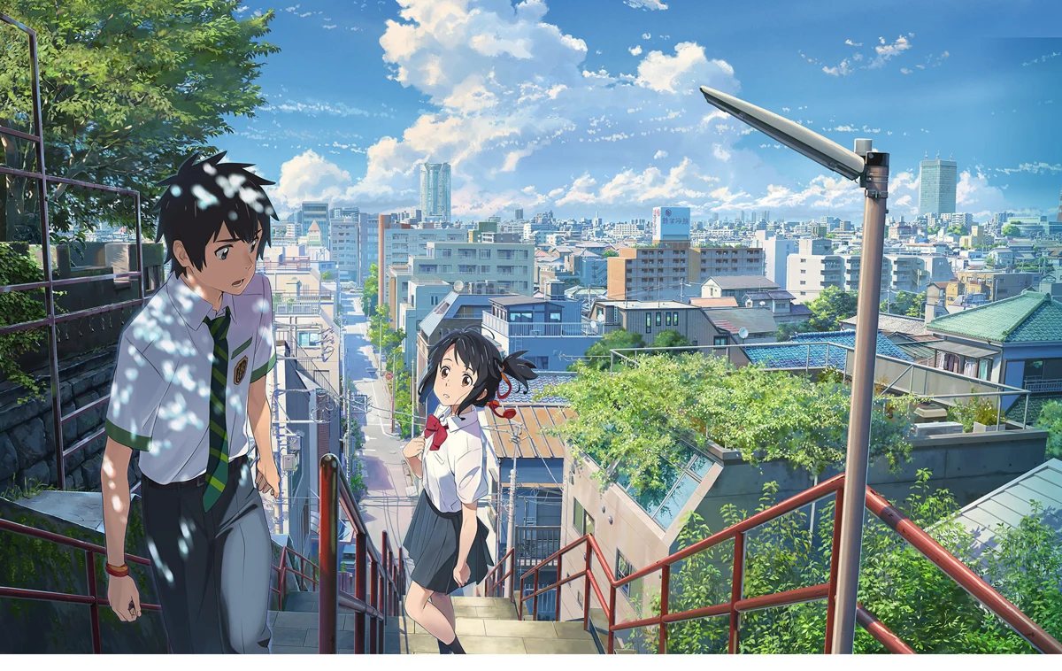 Mitsuha and Taki pass one another on Tokyo stairs in official Your Name key art