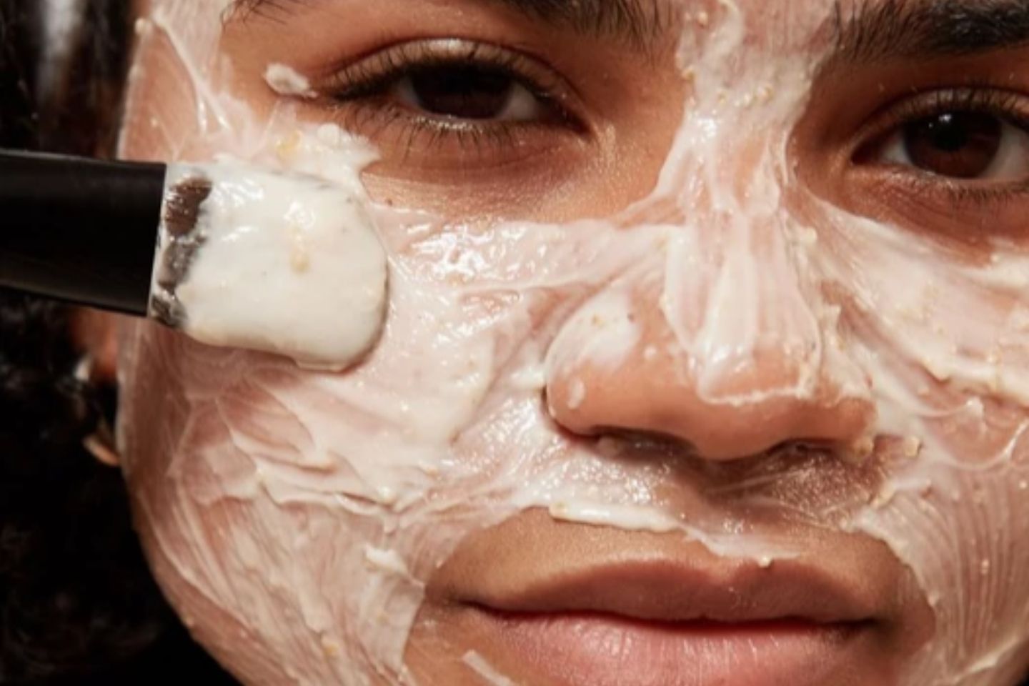 Photo of woman with oatmeal face mask on