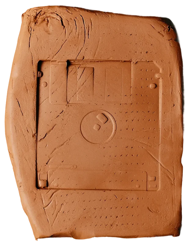 The imprint of an old computer disk on clay
