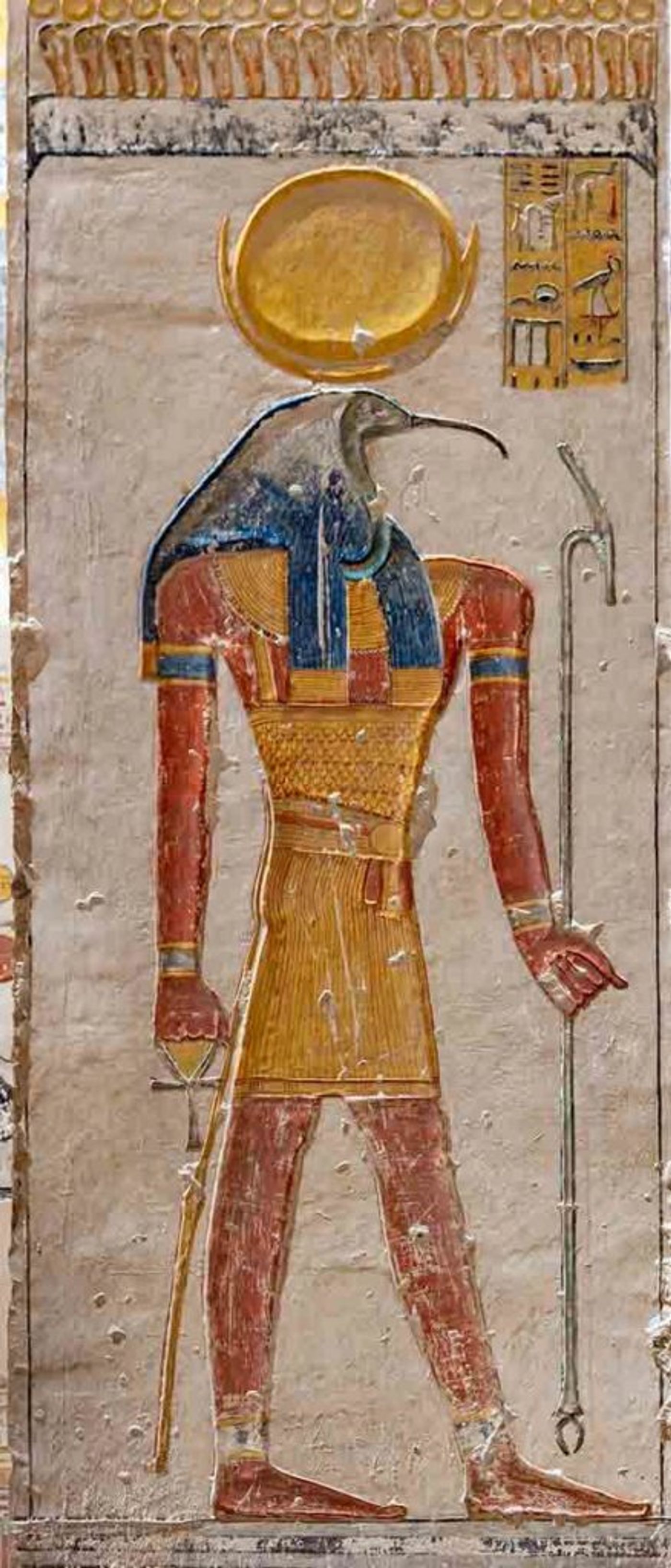 a carved image of Thoth, the Egyptian god of writing.