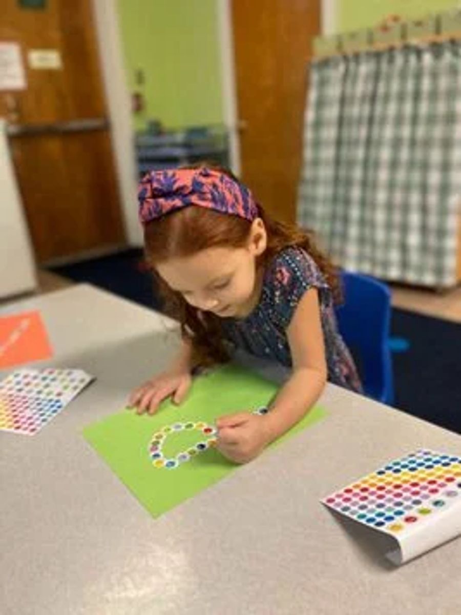 Small Girl doing a craft