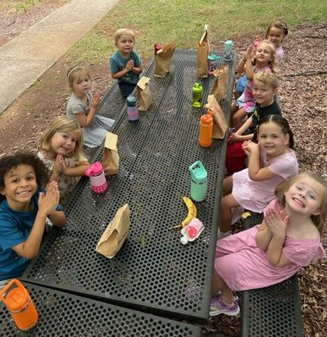 Day School Students inside Sanctuary eating lunch outside