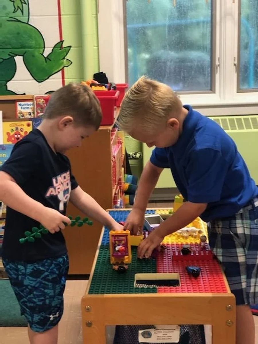 Day School Students playing with toys