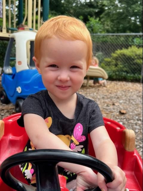 Day School Student on playground car
