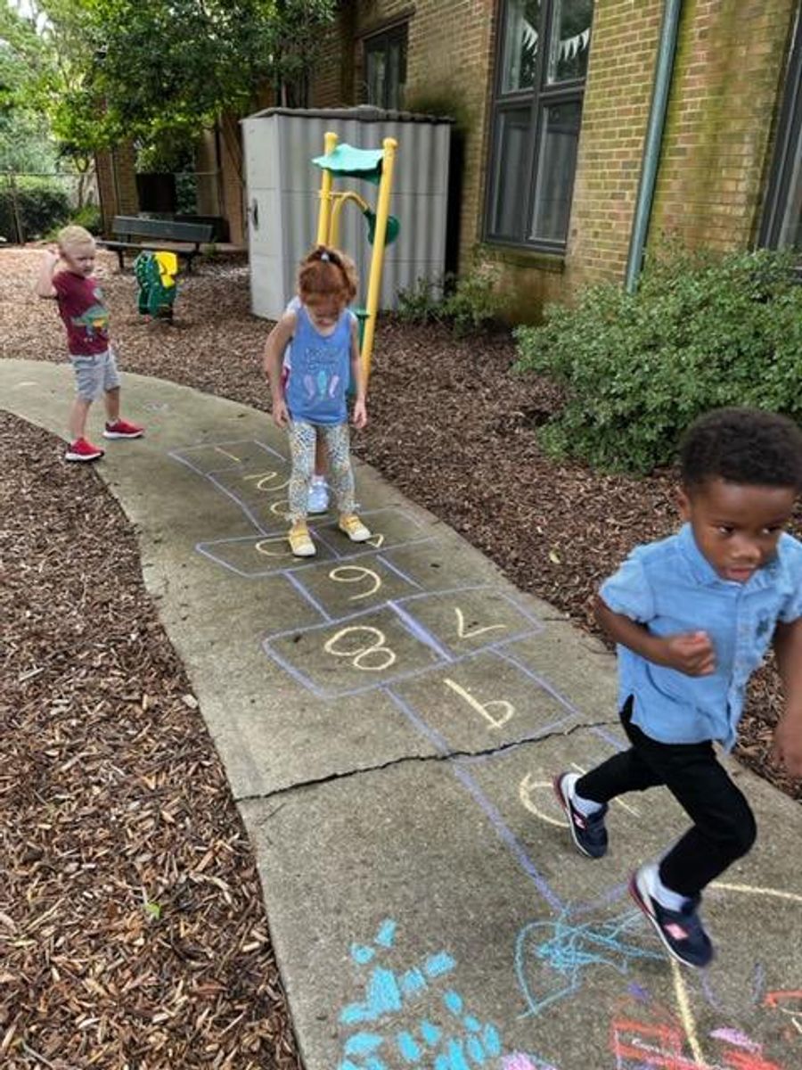Day School Students playing hopscotch