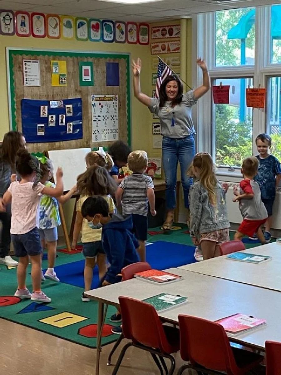Day School Students dancing with teacher