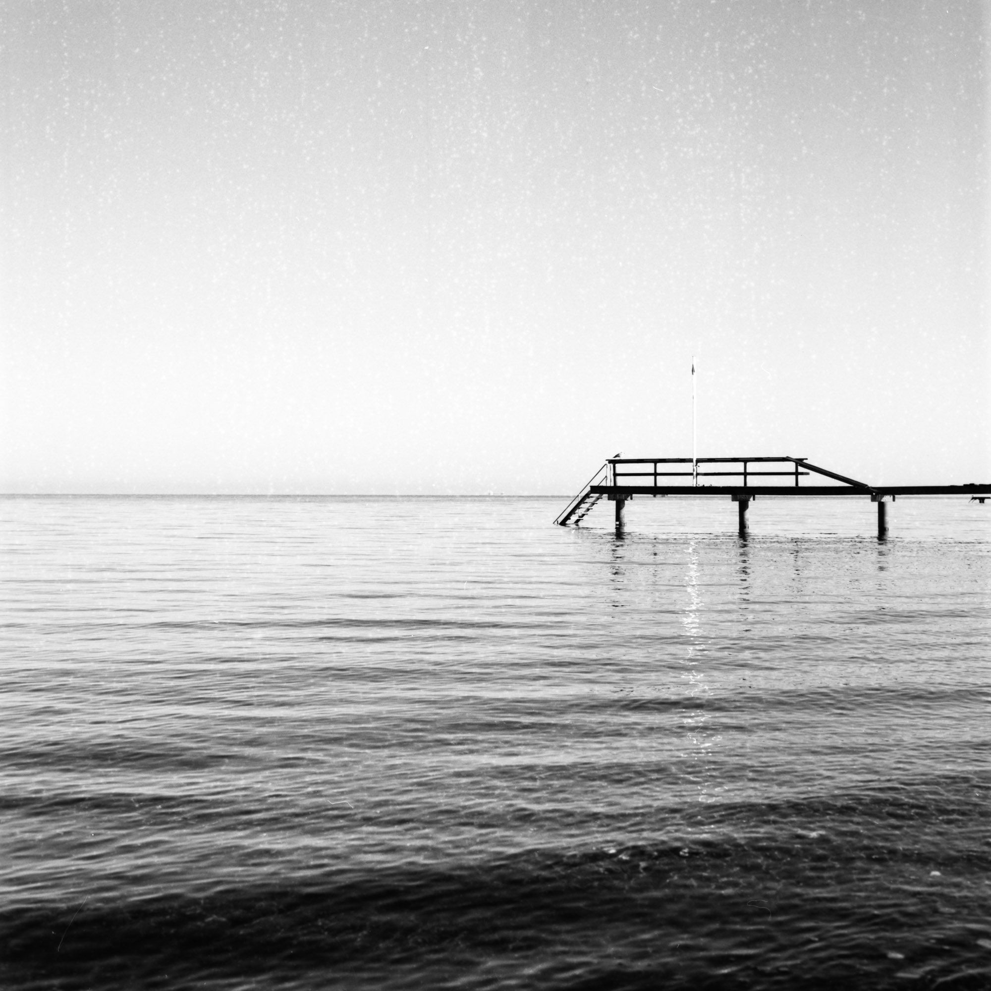 A bridge leads into the wide sea