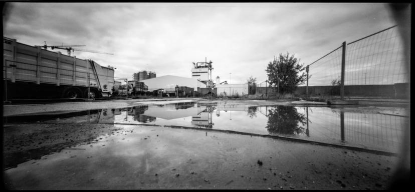 Urban reflections. | Pinhole photography with Holga 120 WPC Urban reflection in a puddle.