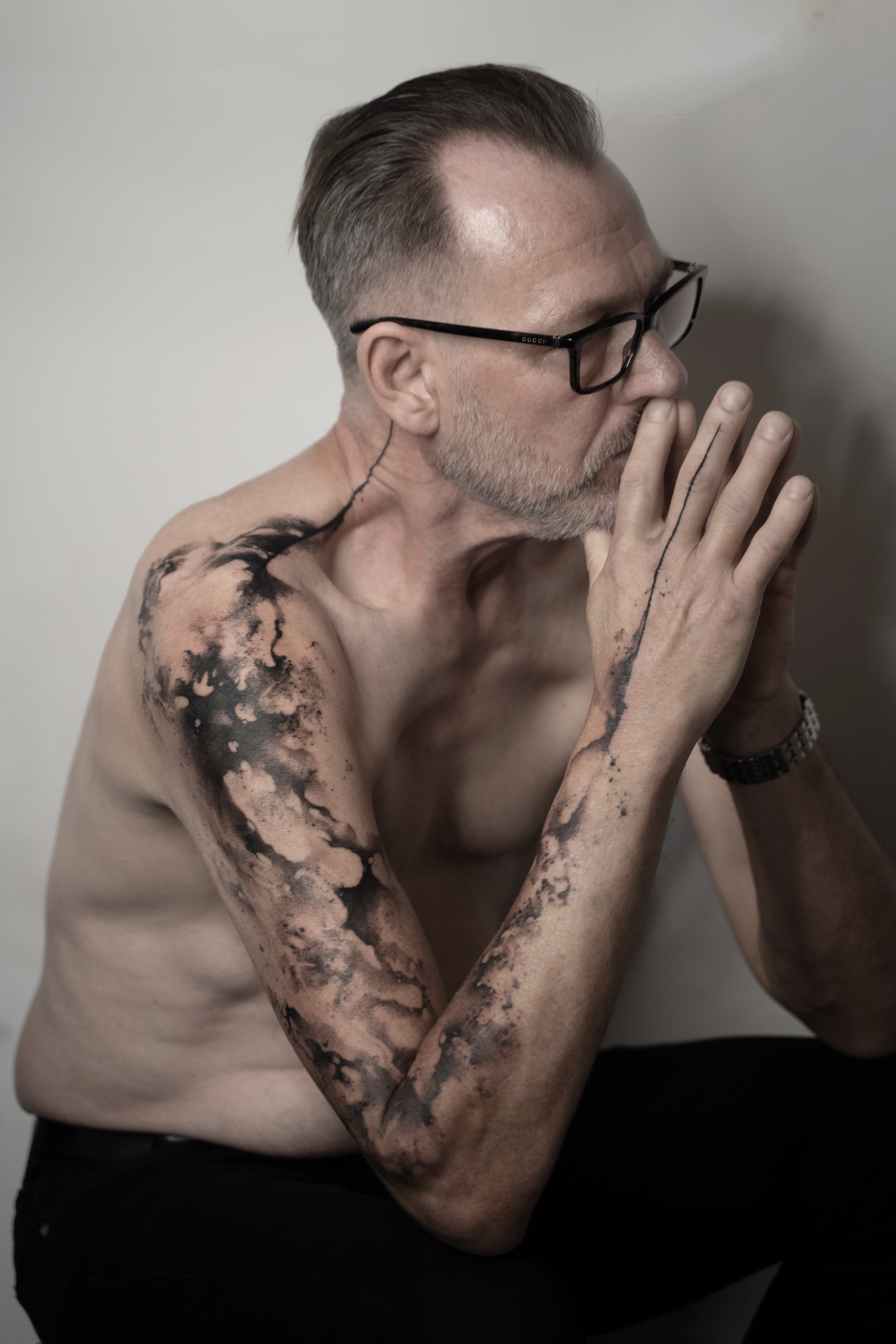 Abstract, black and grey freehand arm tattoo concept