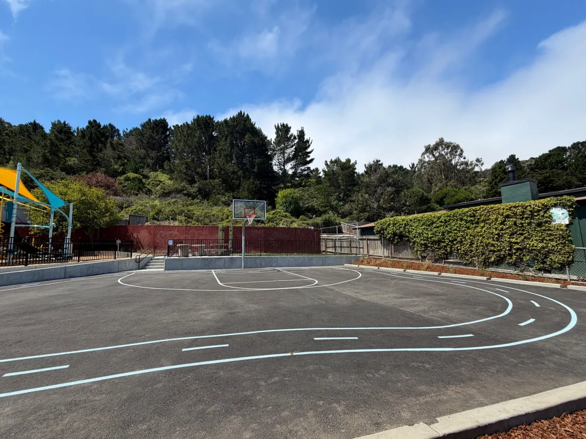 Basketball courts with a race track for toddler push cars