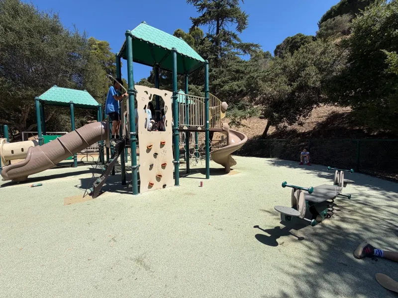 See saw. rock wall, and slides