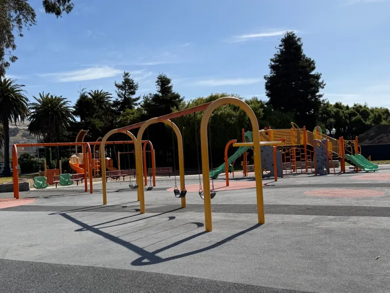 Lots of swings available next to playground