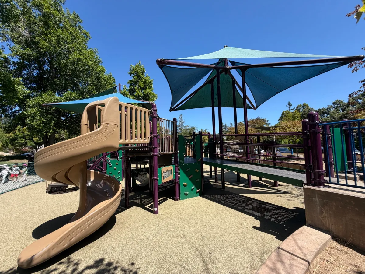 Big kid playground spiral slide, bridge, rock climbing walls