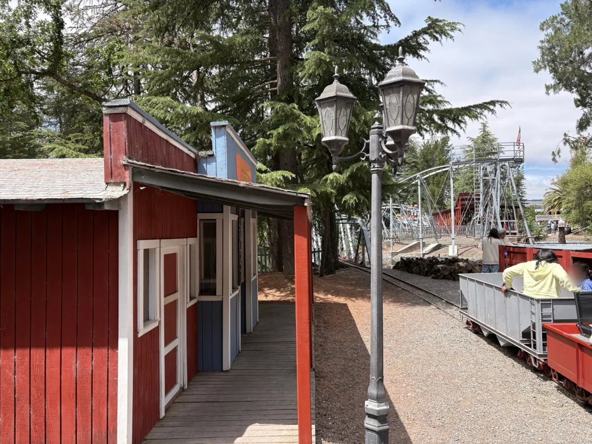 Train exiting mini town