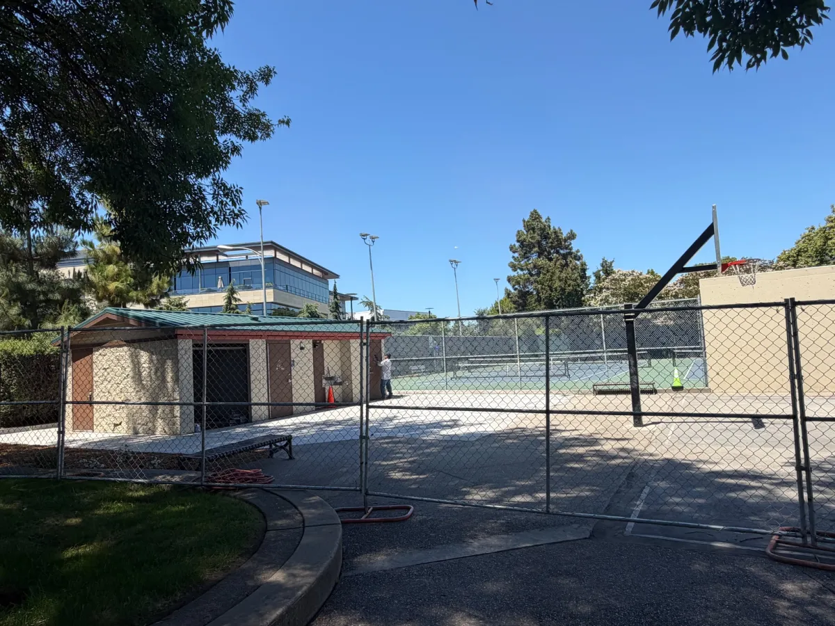Bathrooms currently under renovation and sectioned off together with basketball court