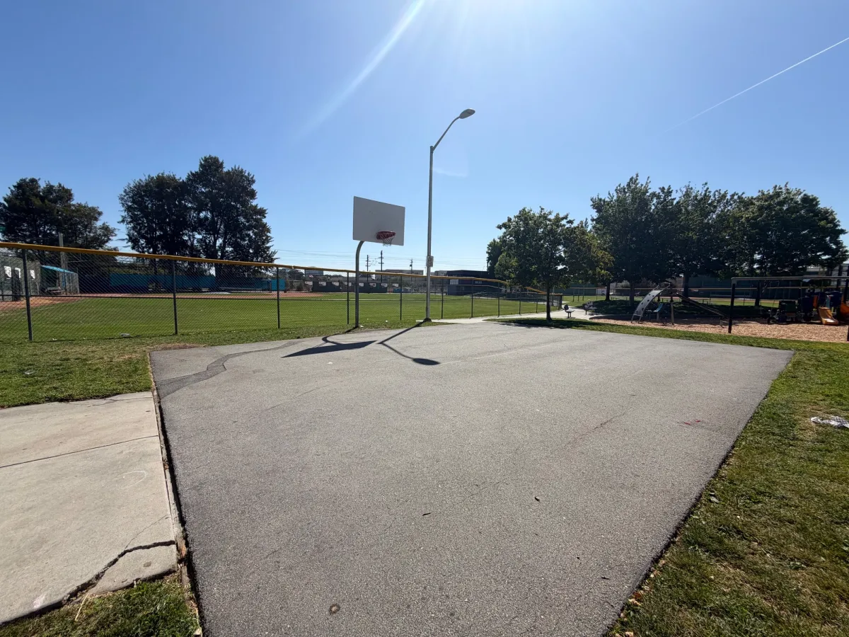 Basketball court close to toddler playground