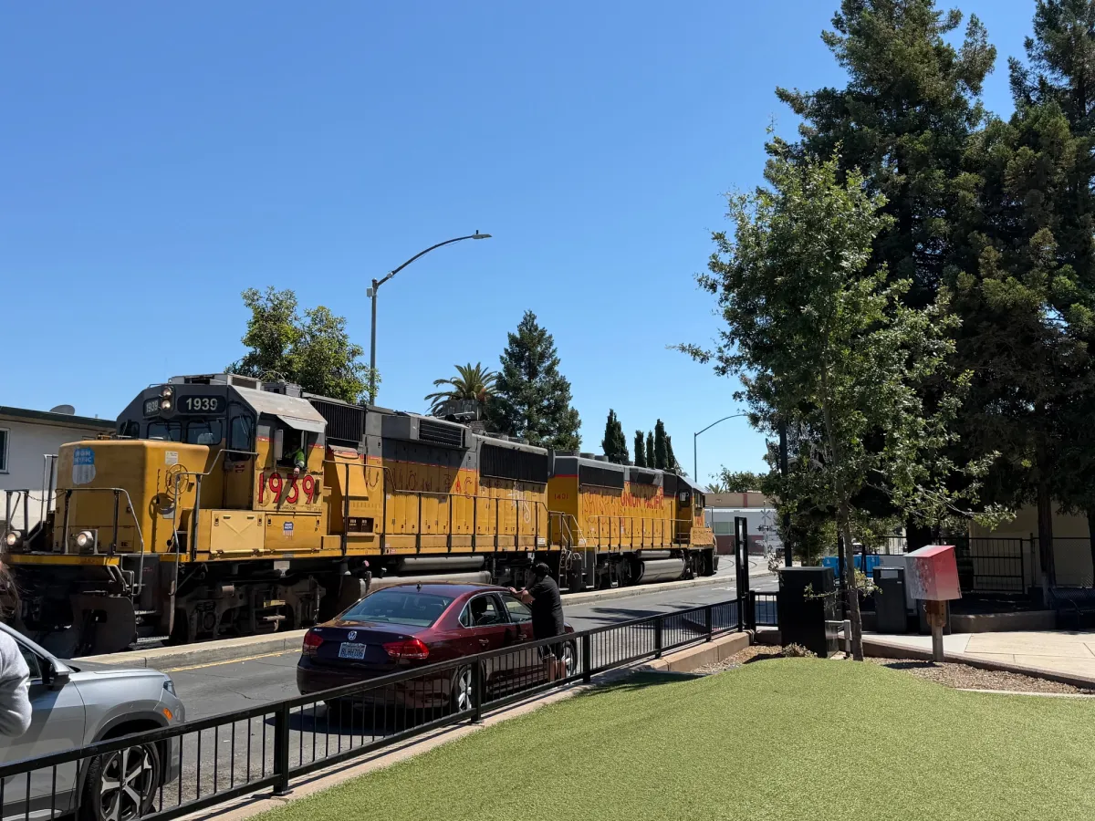 Train runs right in front of playground 