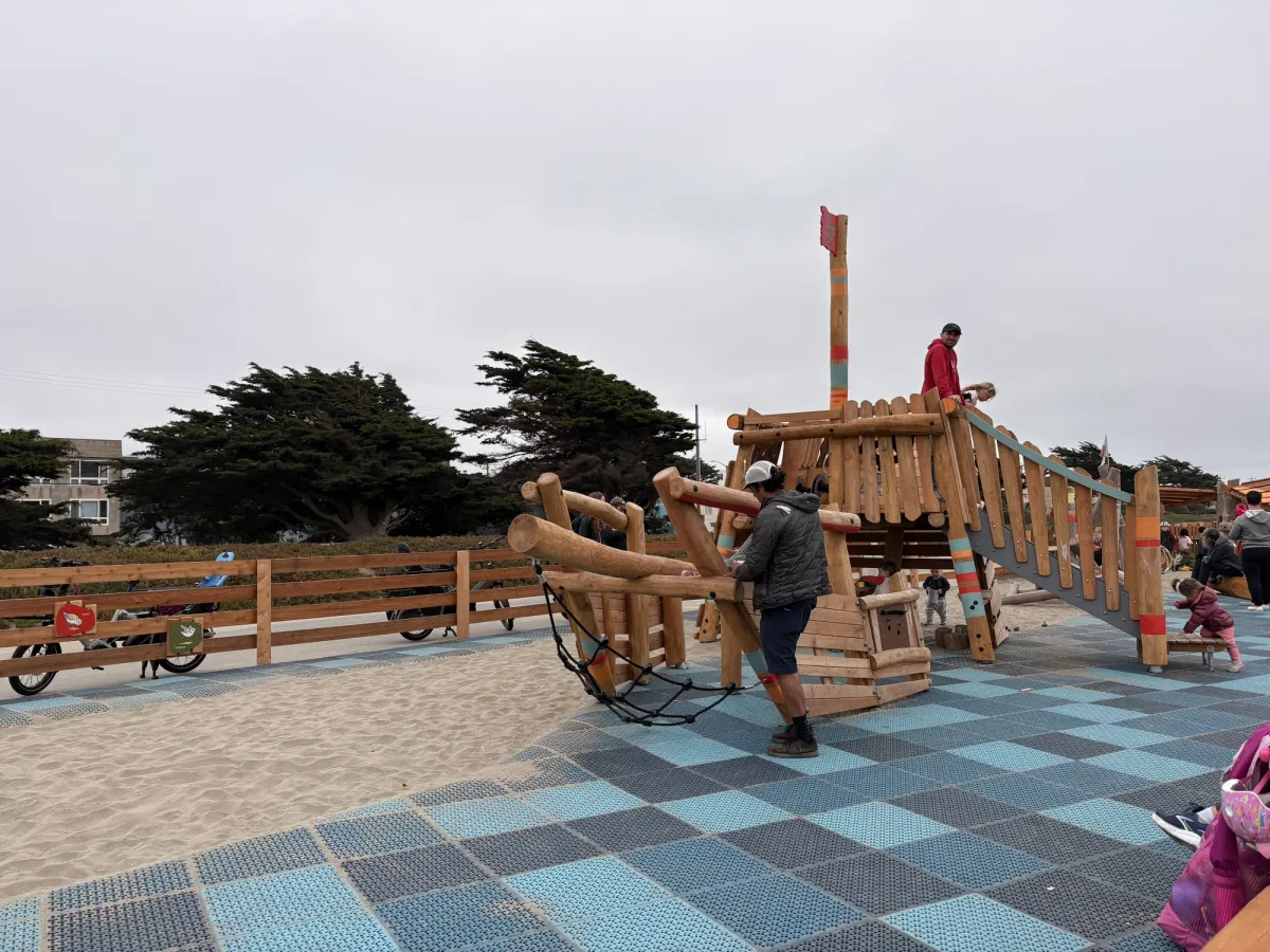 wide shot of the ship wreck and how it goes into the sand pit