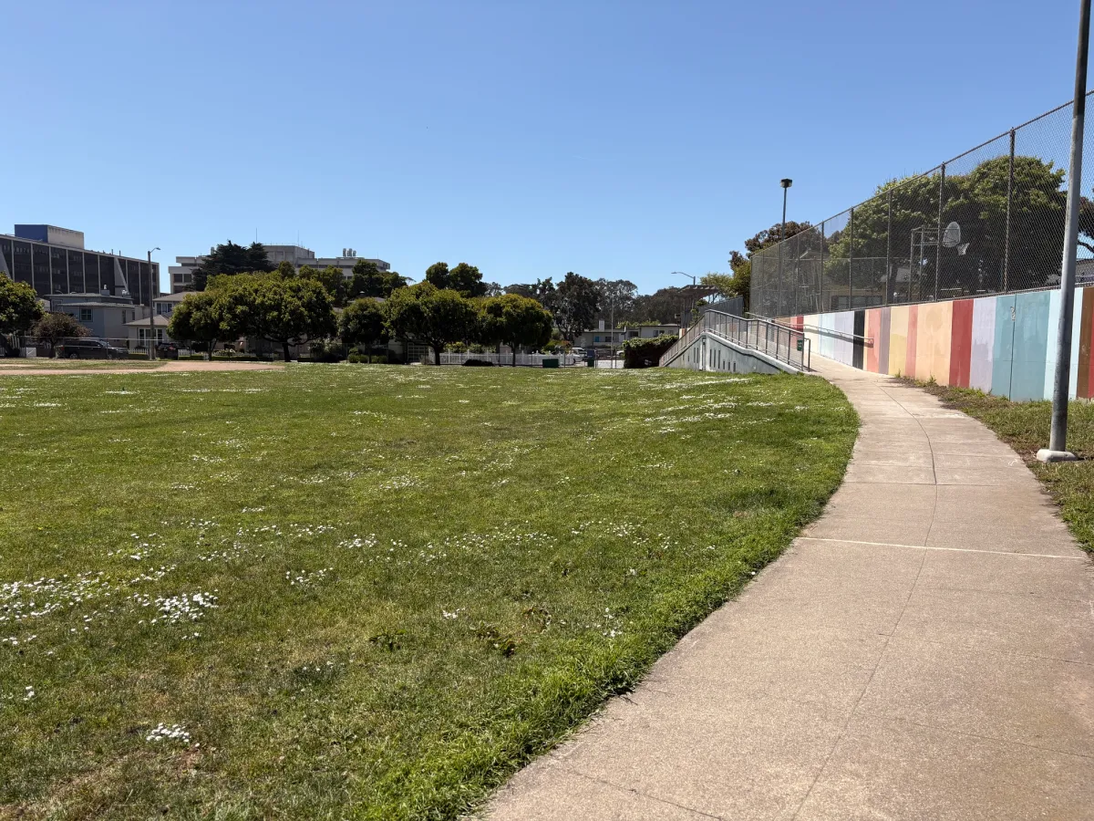 Enclosed Baseball Field and ramp up to the playground