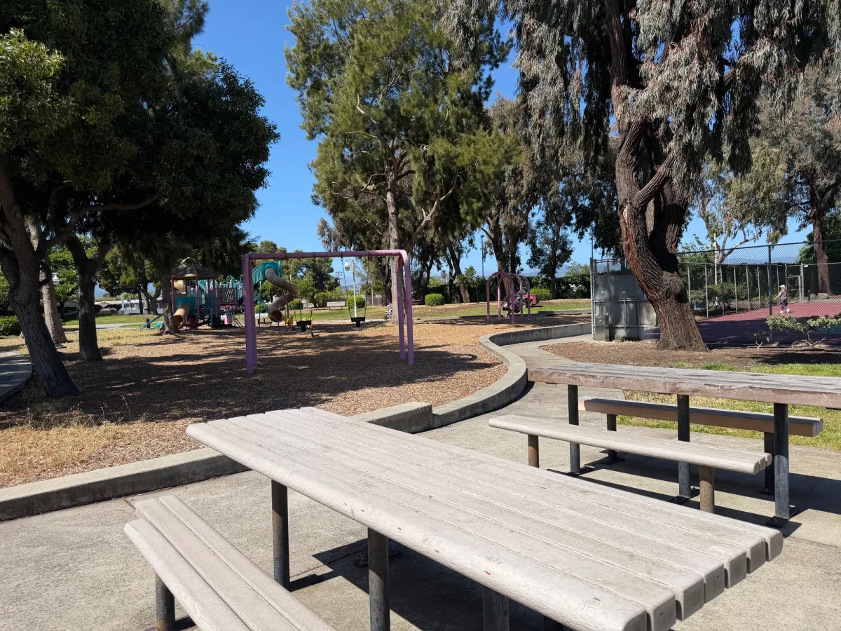 Additional picnic tables near playground and tennis courts