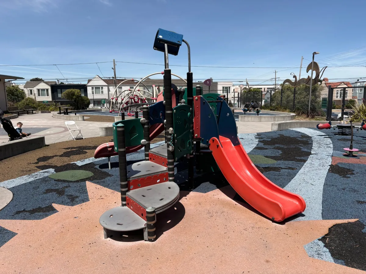 Toddler area with small slides and teeter totter