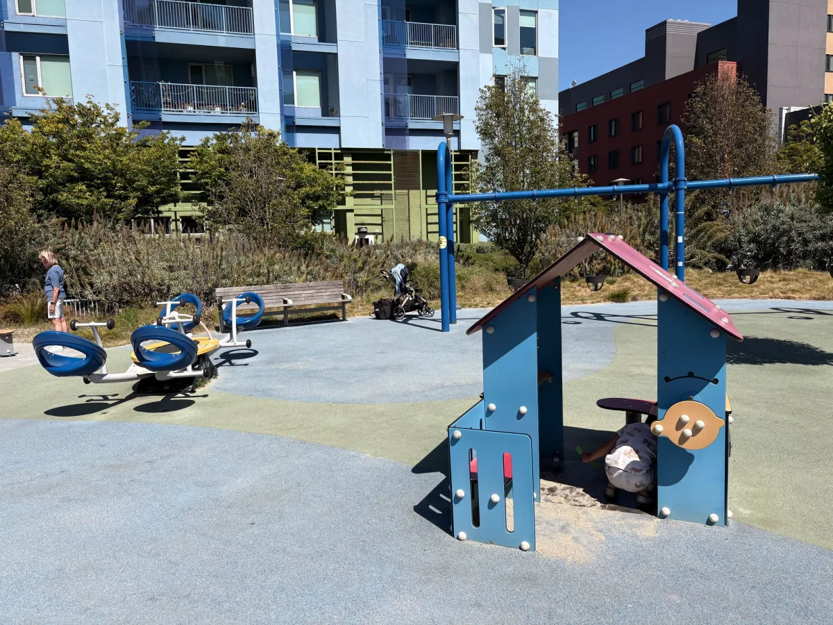 Group seesaw, little hut and bucket swings in the background