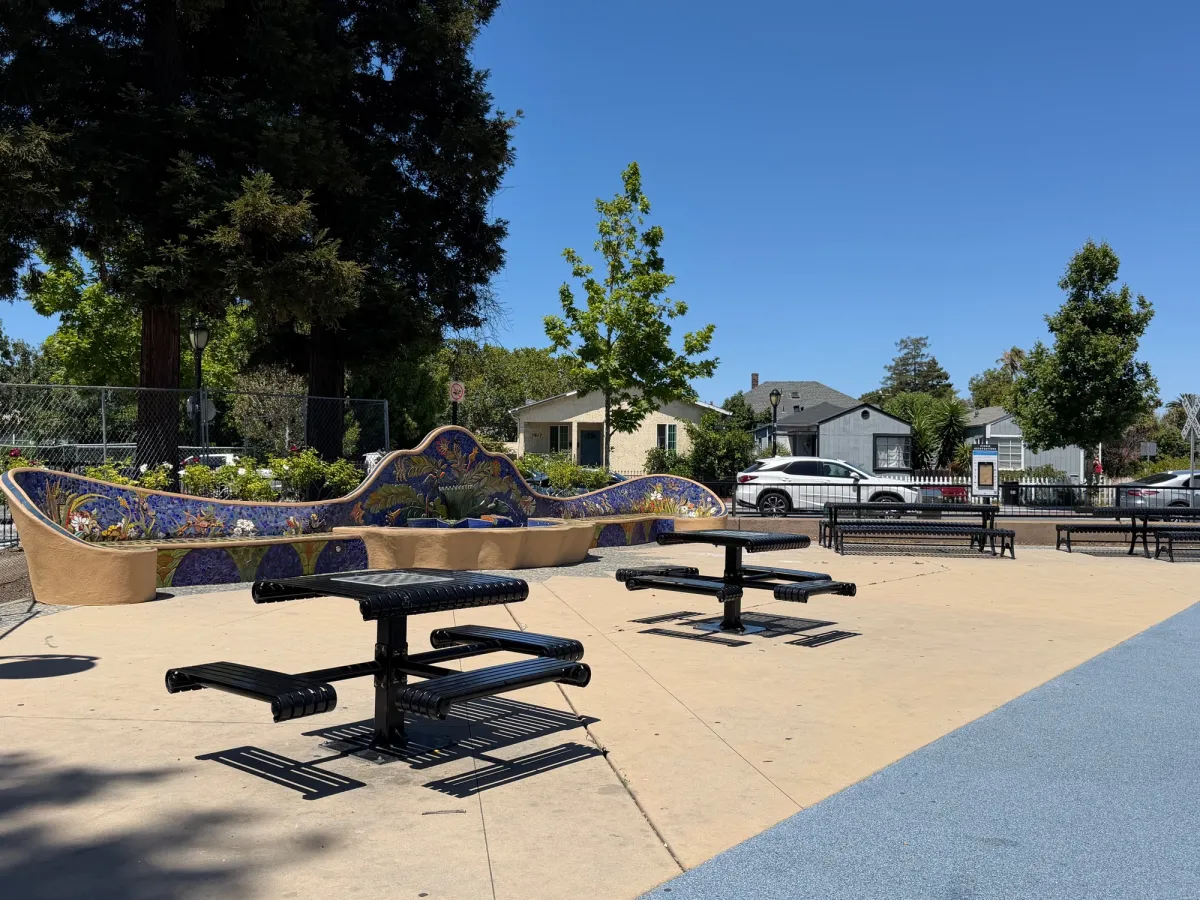 Several picnic tables by the fountain