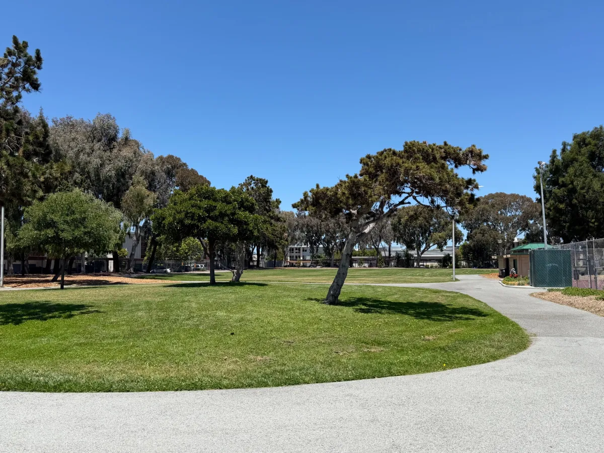Walk from parking lot towards playground, lots of grassy field space