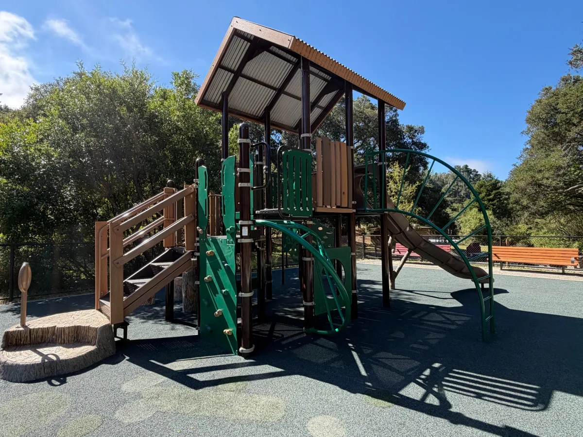 Back of De Anza playground includes a rock wall and some climbing structures