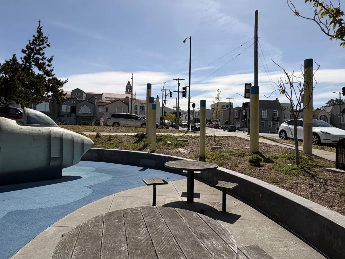 Sunken barrier that prevents kids from running out onto the street. Still a warning to parents.