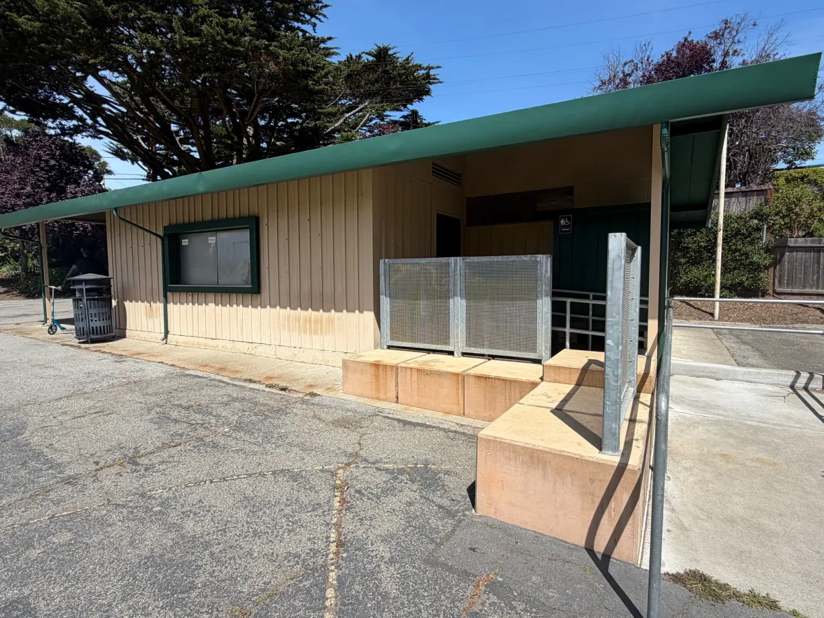 Bathroom exterior located near tennis courts and baseball field