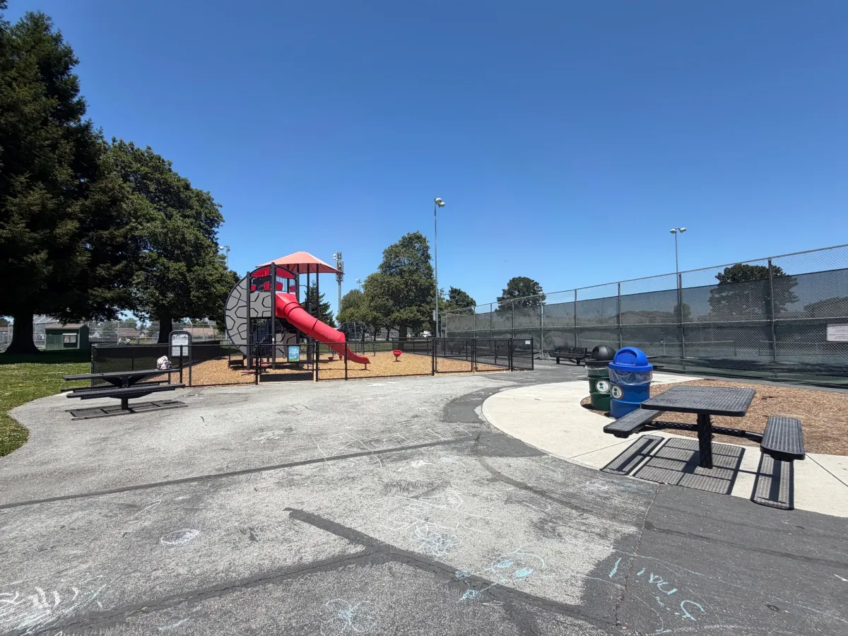 No seating in park, but there are picnic tables outside fence
