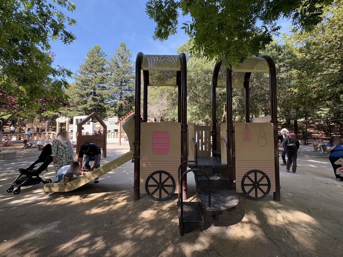 Train play structure in the sand
