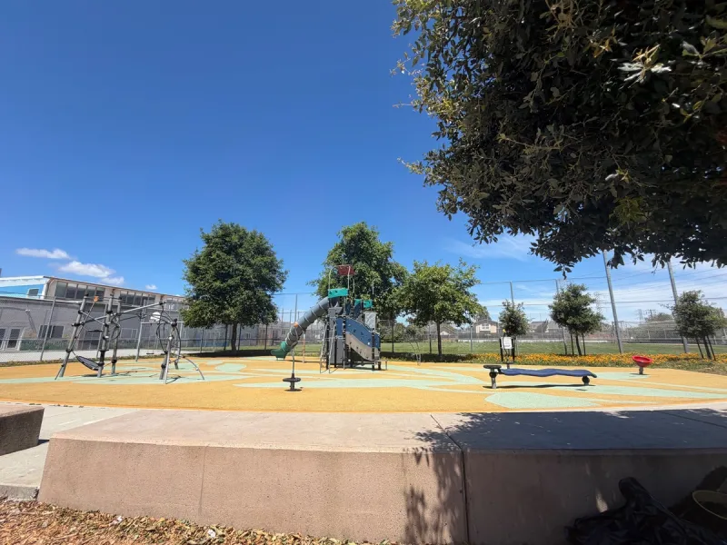 Big kid playground equipment with slides, climbing structure, spinners