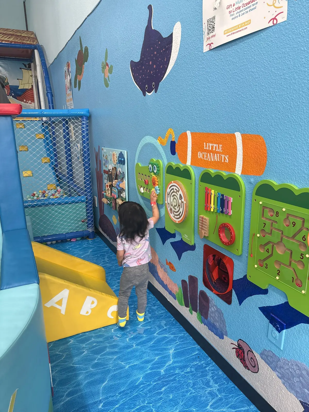 Kiddos playing with the wall pieces