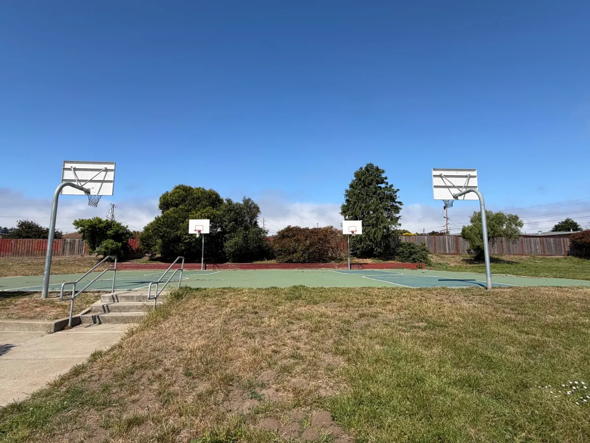 Basketball courts next to playground