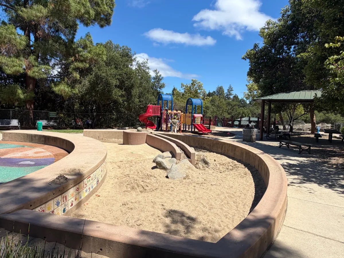 Sand pit area next to splash pad - also has it's own mini water play feature