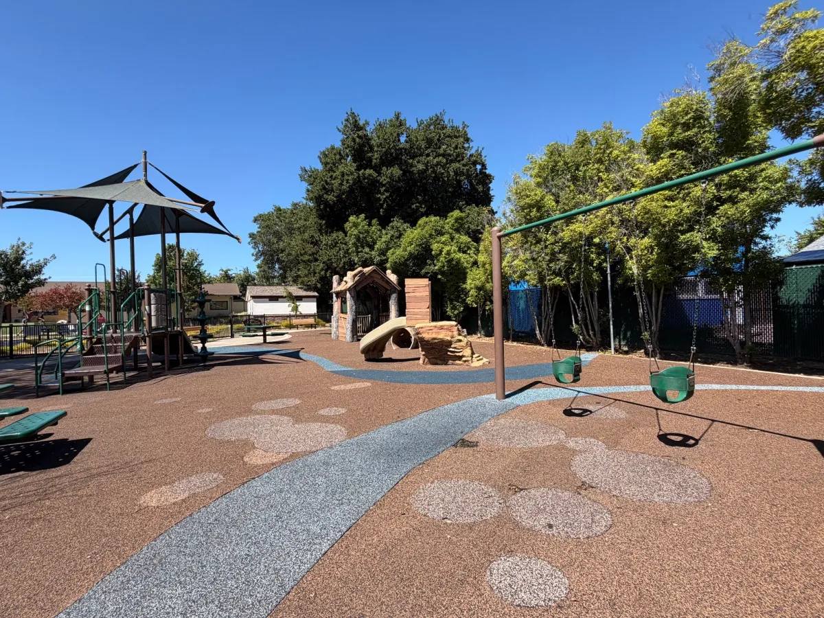 Toddler playground - baby swings, playhouse, and log tunnels