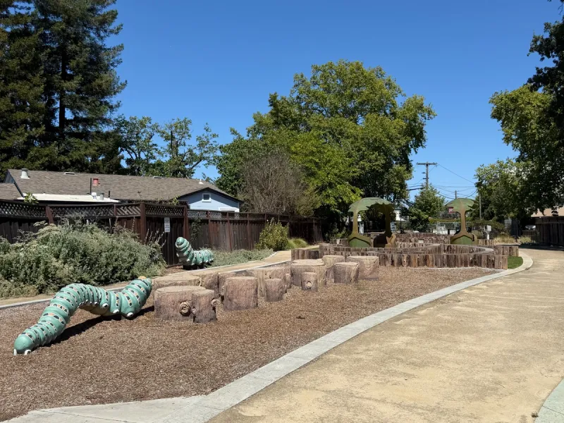 Cute caterpillar statues to climb on and a few stumps to hop onto