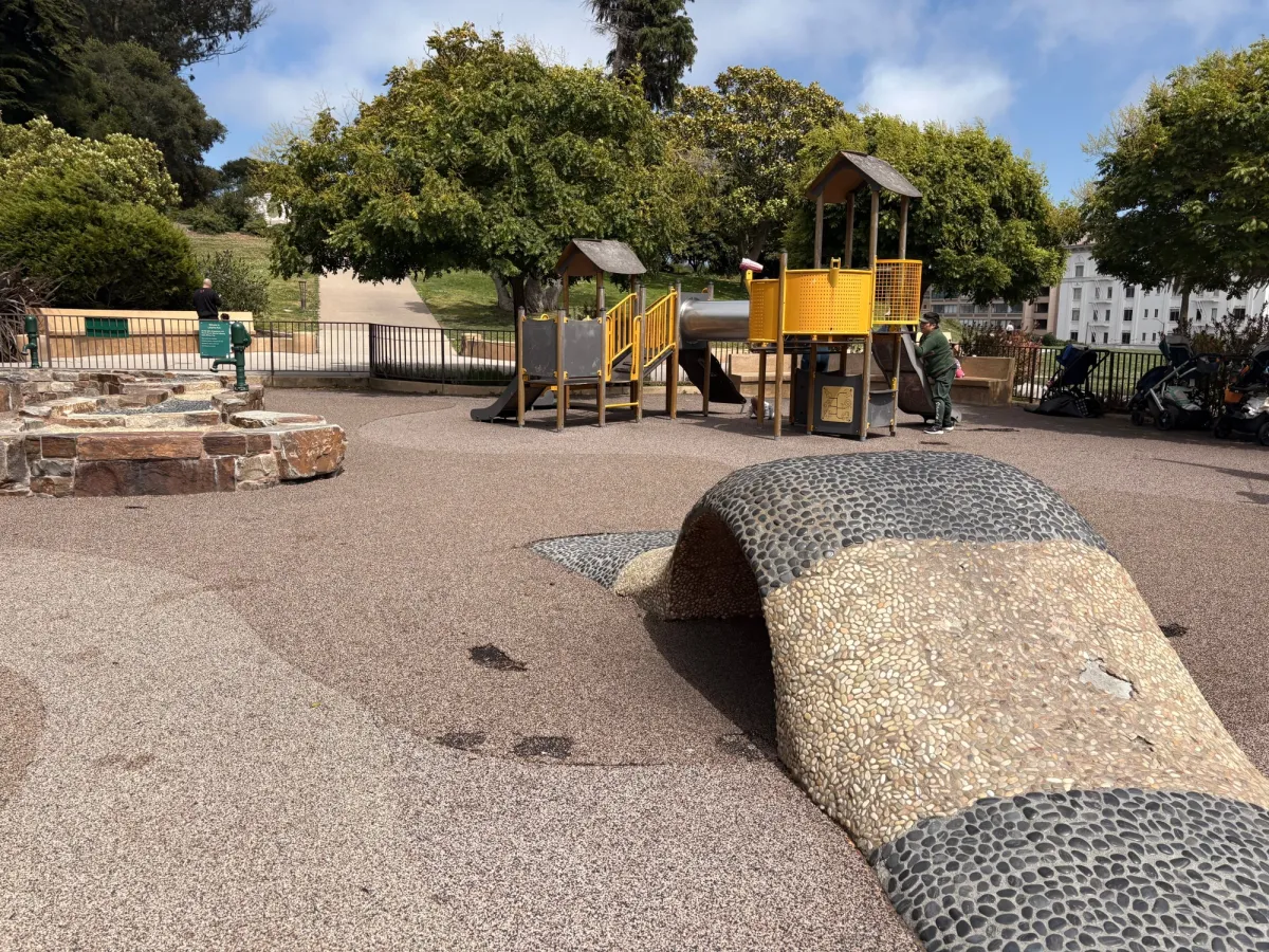 Pebbled climbing structure and toddler corner
