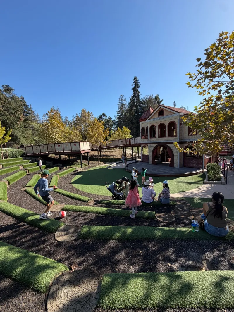 Giant playhouse, stage, and nice seating area surrounding it