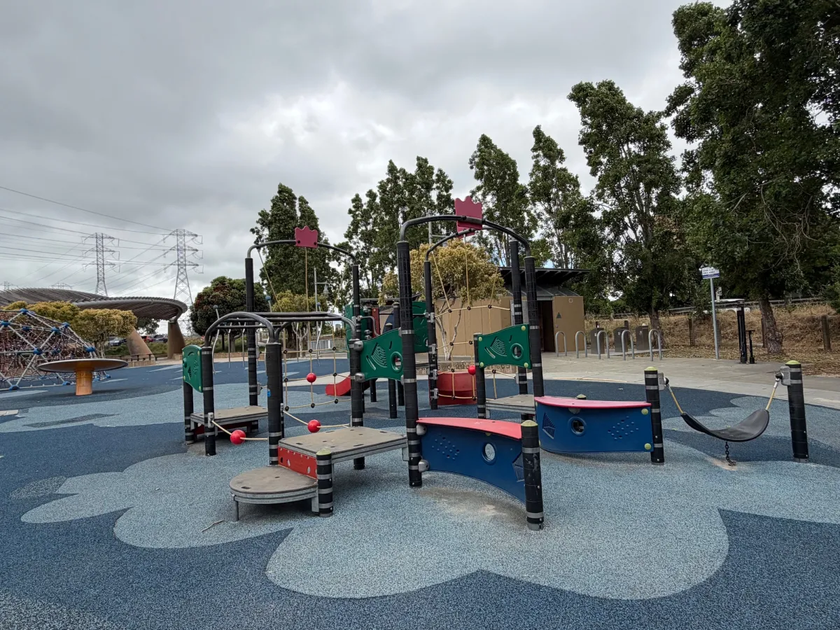 Toddler play structure includes cimbing ropes, hammock, and small slide