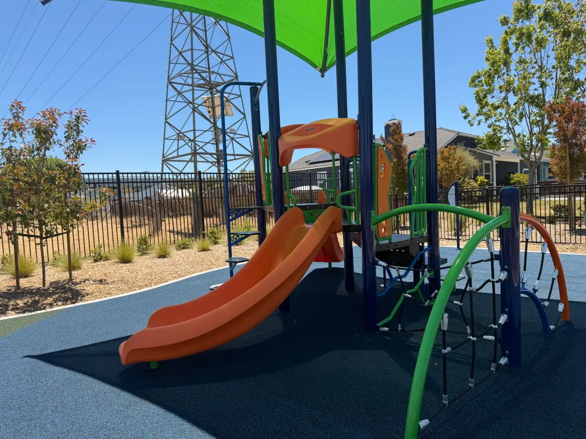 Toddler zone has its own shade cover, little slide, and climbing structure