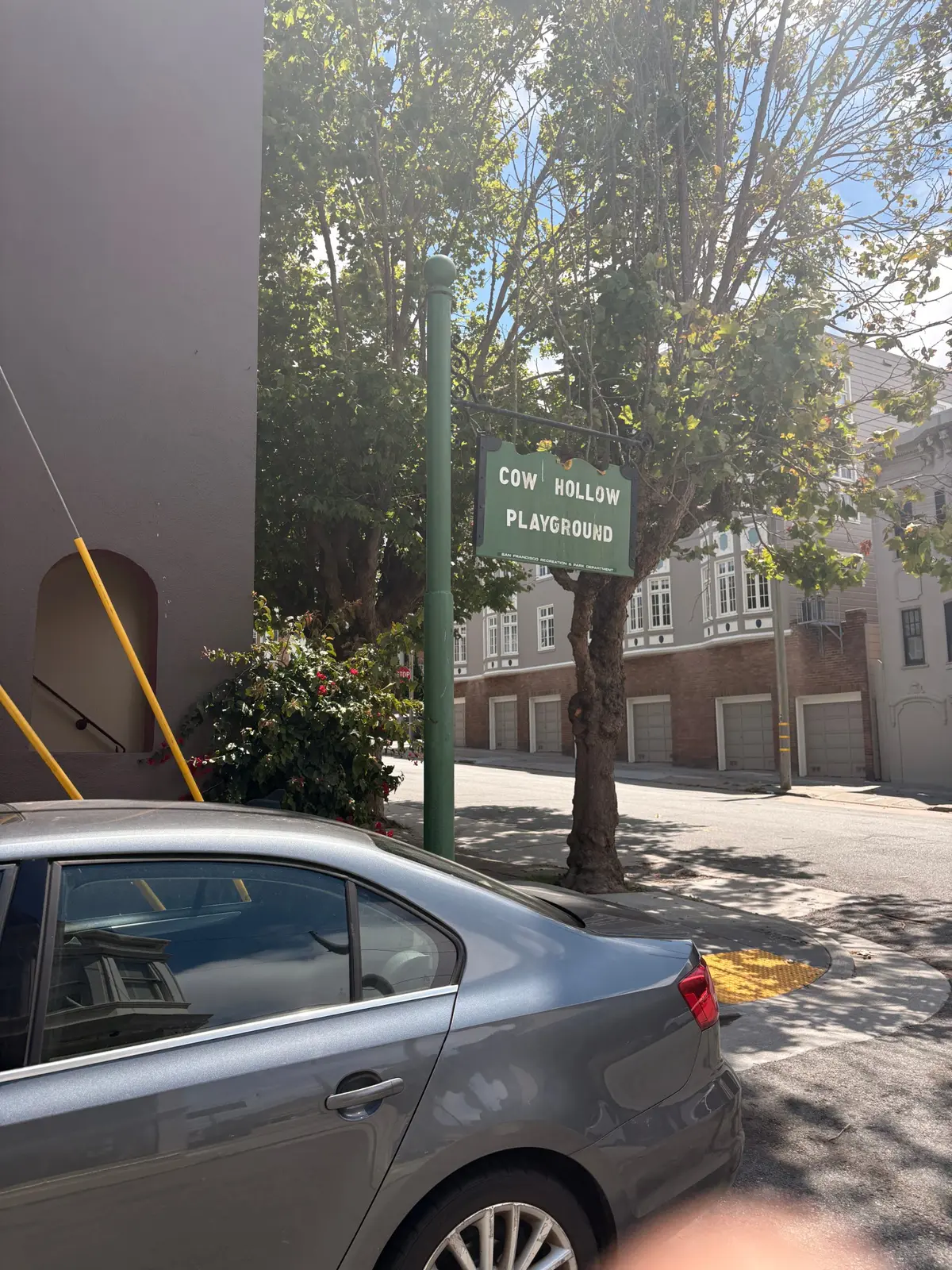 A small park sign can be easily missed when you're walking past this small no outlet street